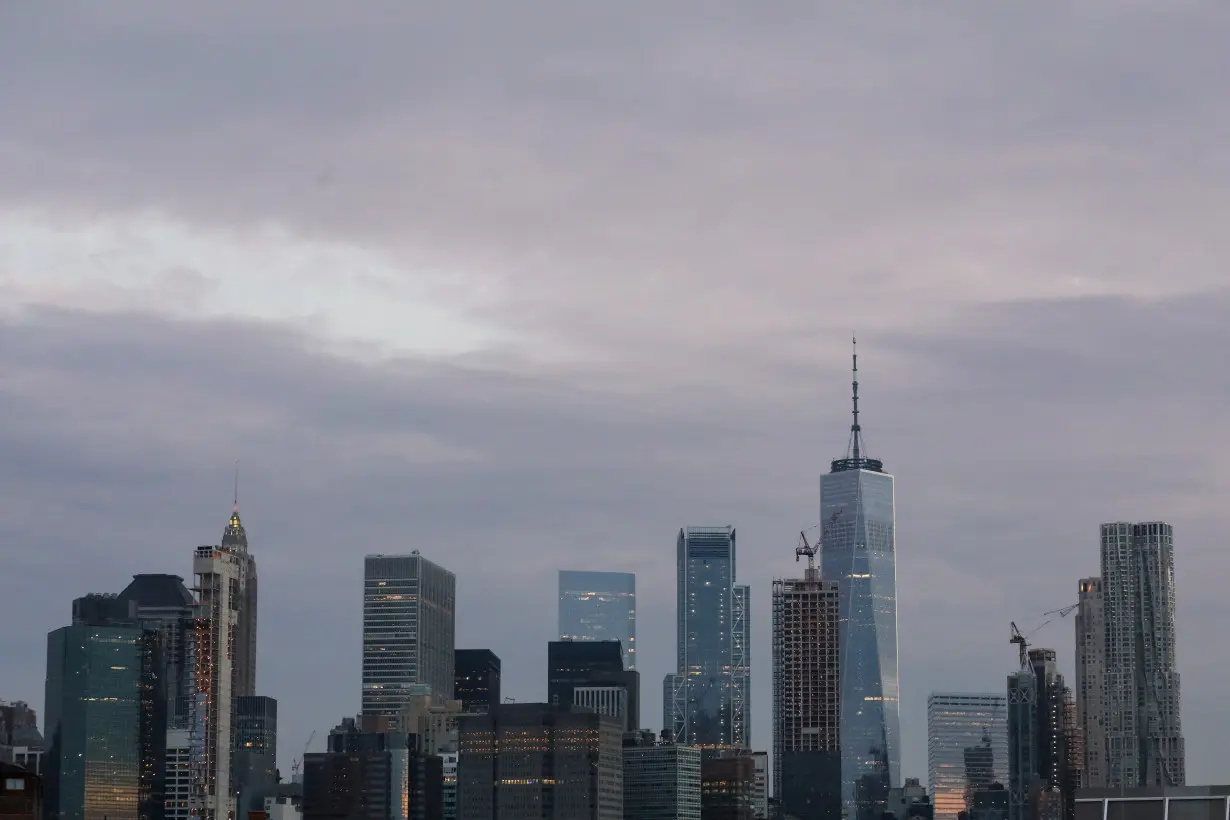 The skyline of lower Manhattan is seen before sunrise in New York