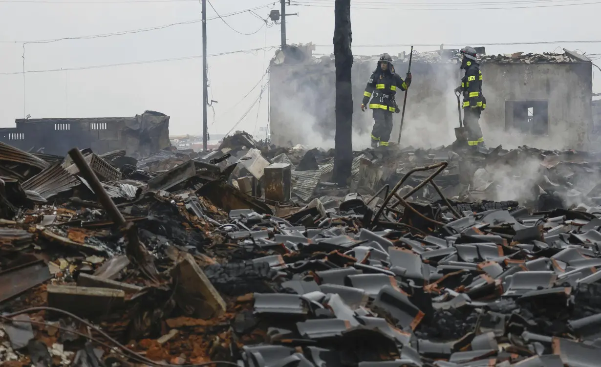 Rescuers race against time in search for survivors in Japan after powerful quakes leave 78 dead