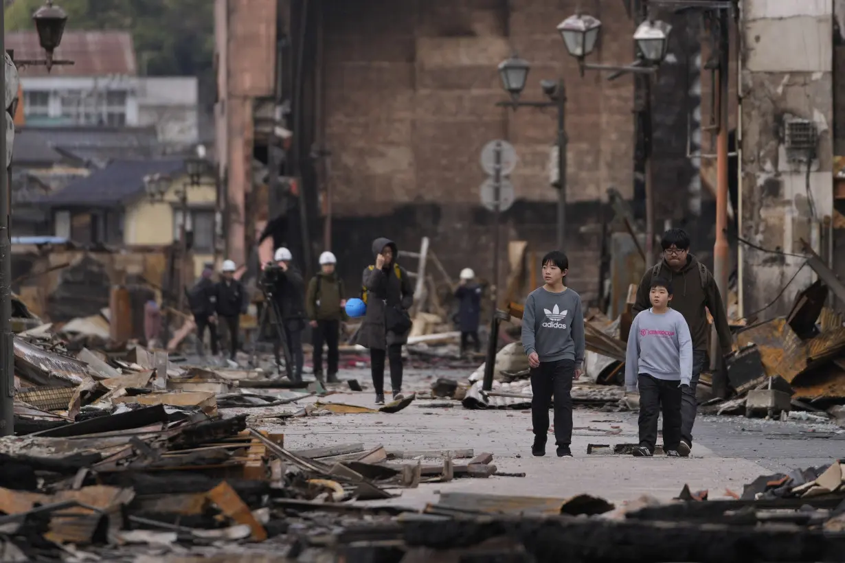 Death toll reaches 100 as survivors are found in homes smashed by western Japan earthquakes