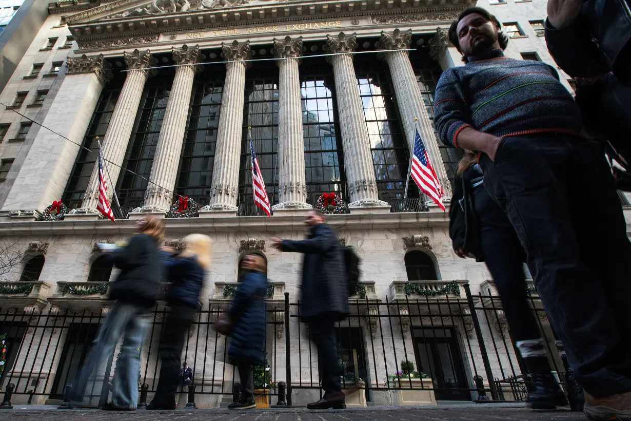 FILE PHOTO: Wall Street ends slightly lower, capping blockbuster year