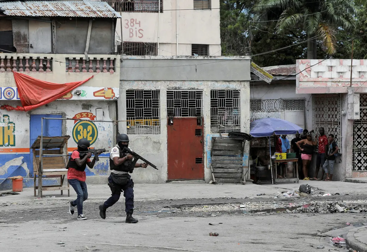 FILE PHOTO: Police patrol the streets after gang members tried to attack a police station, in Port-au-Prince