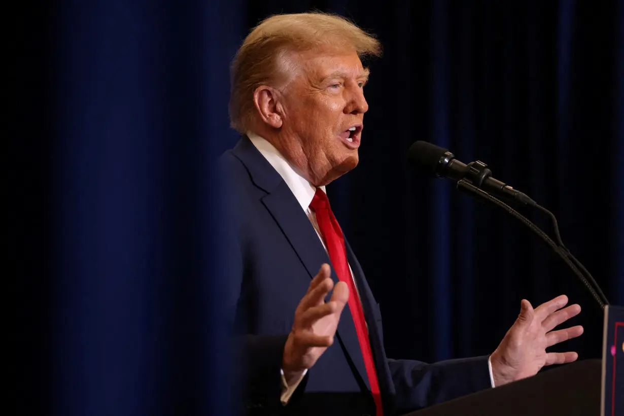 FILE PHOTO: Republican presidential candidate and former U.S. President Trump attends a campaign event in Waterloo, Iowa