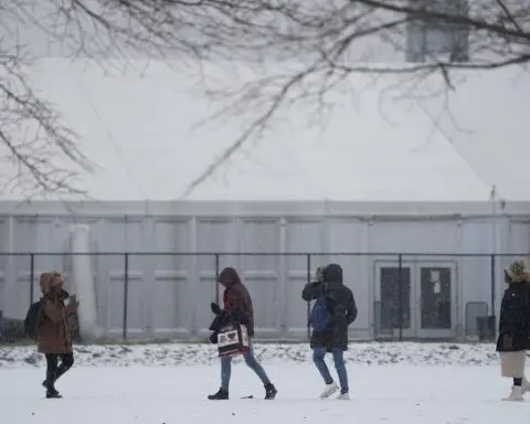 With beds scarce and winter bearing down, a tent camp grows outside NYC's largest migrant shelter