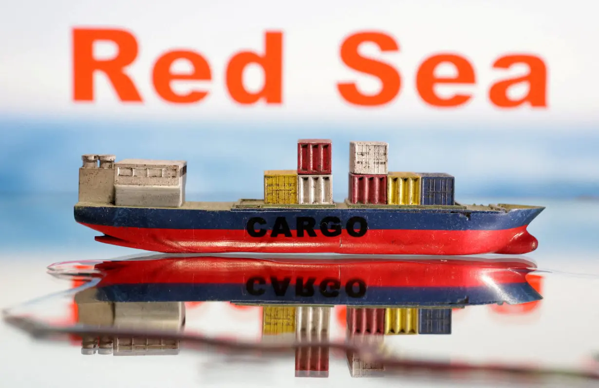 FILE PHOTO: Illustration shows a cargo ship boat model and 