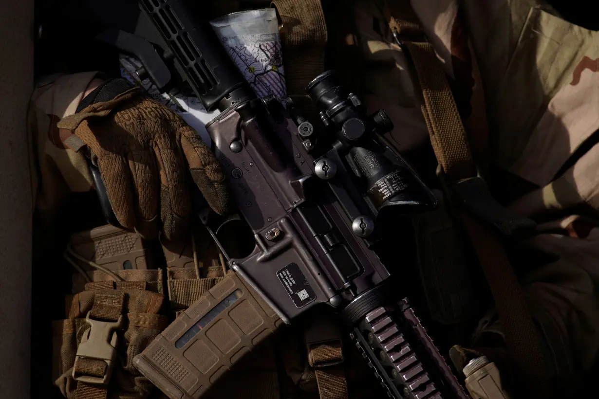 FILE PHOTO: A U.S. Marines from the 1st Marine Division holds his weapon during 