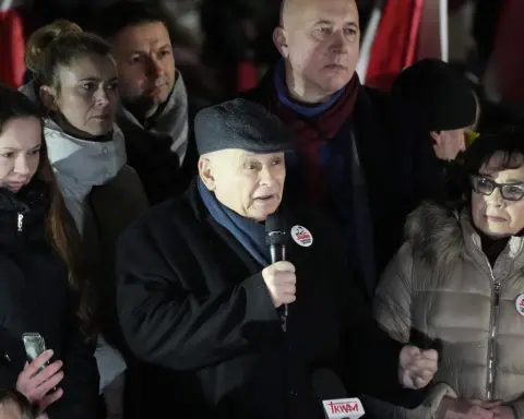 Poland's president plans to pardon 2 politicians as tens of thousands hold anti-government protest