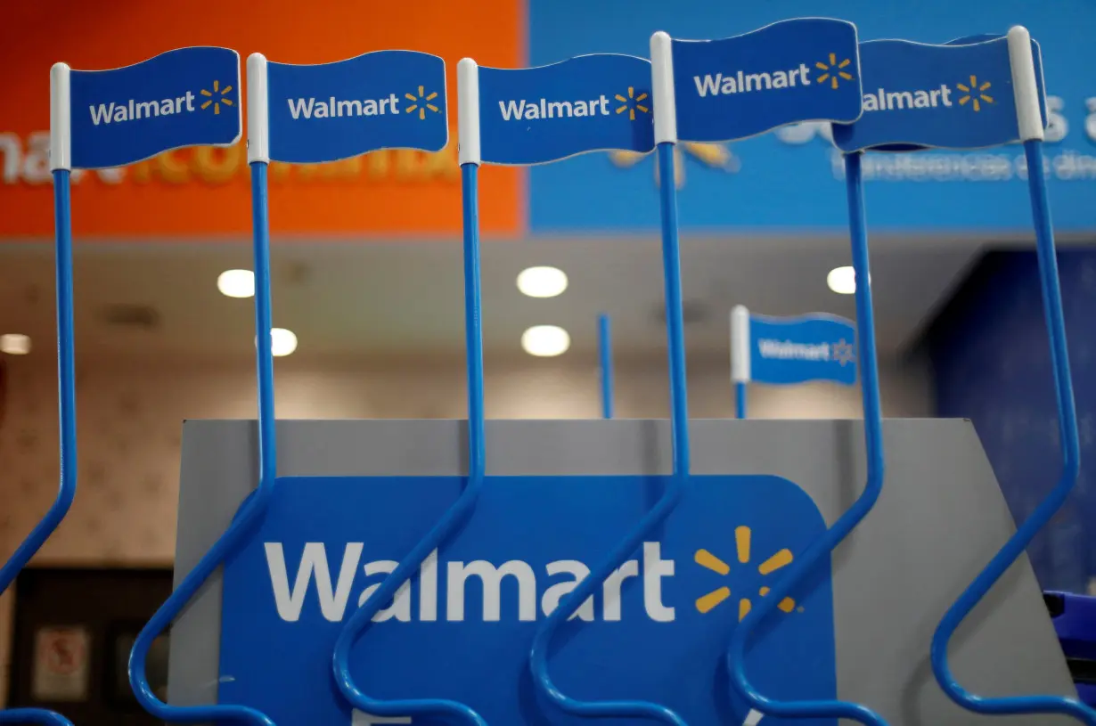 FILE PHOTO: Walmart signs are displayed inside a Walmart store in Mexico City