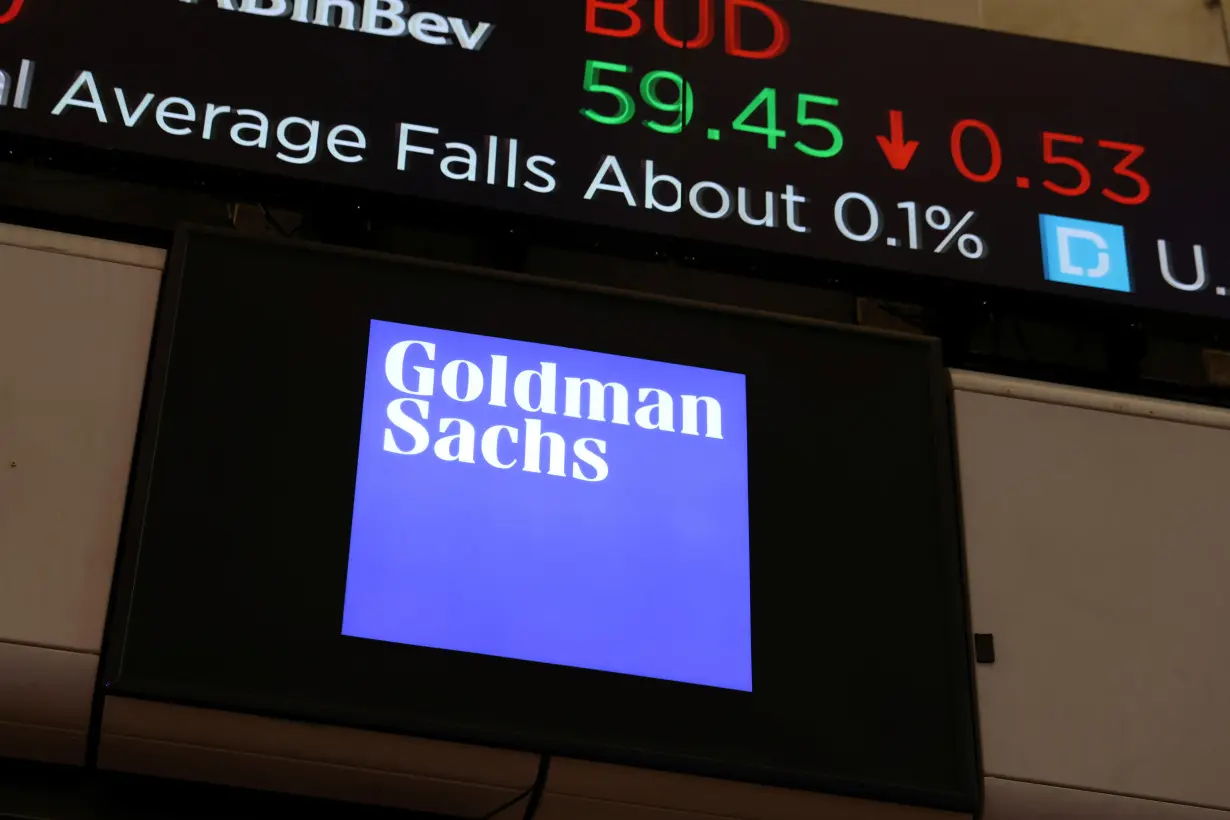 FILE PHOTO: The logo for Goldman Sachs is seen on the trading floor at the New York Stock Exchange (NYSE) in New York City