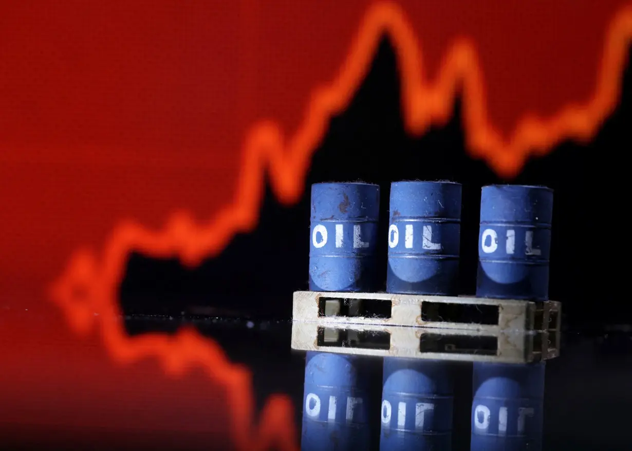 Illustration shows Oil barrels in front of rising stock graph