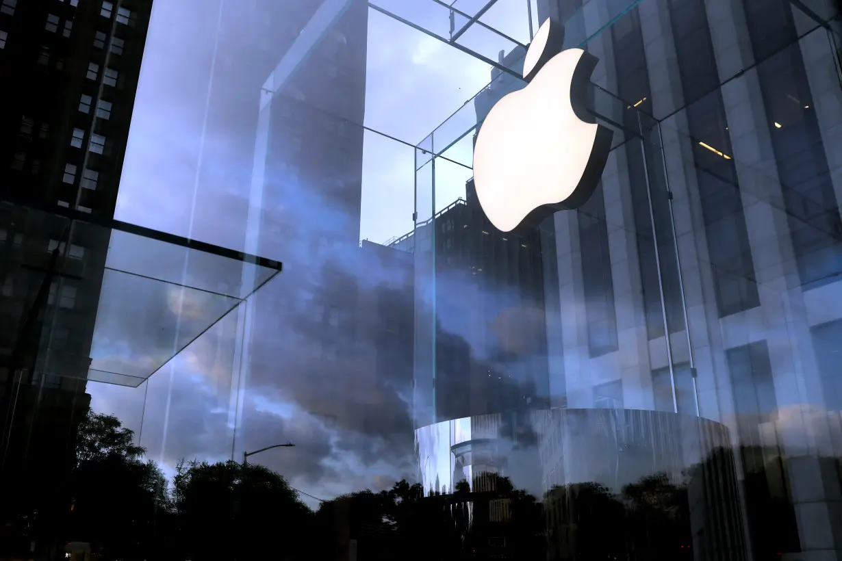 The Apple Inc. logo is seen hanging at the entrance to the Apple store on 5th Avenue in New York