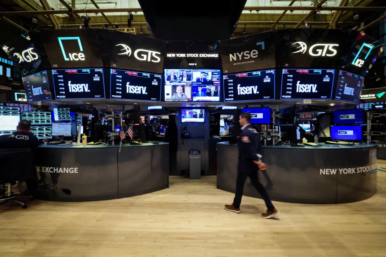 Traders work on the floor of the NYSE in New York