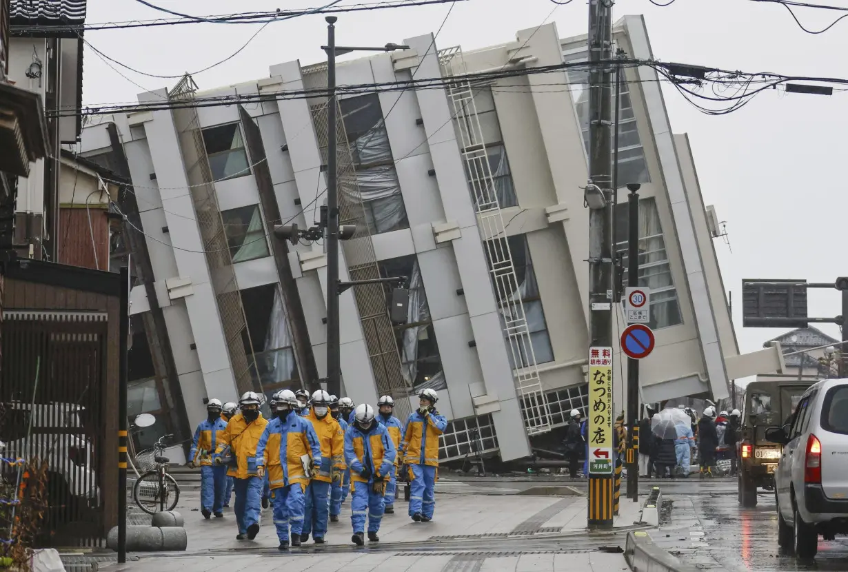 Rescuers race against time in search for survivors in Japan after powerful quakes leave 78 dead