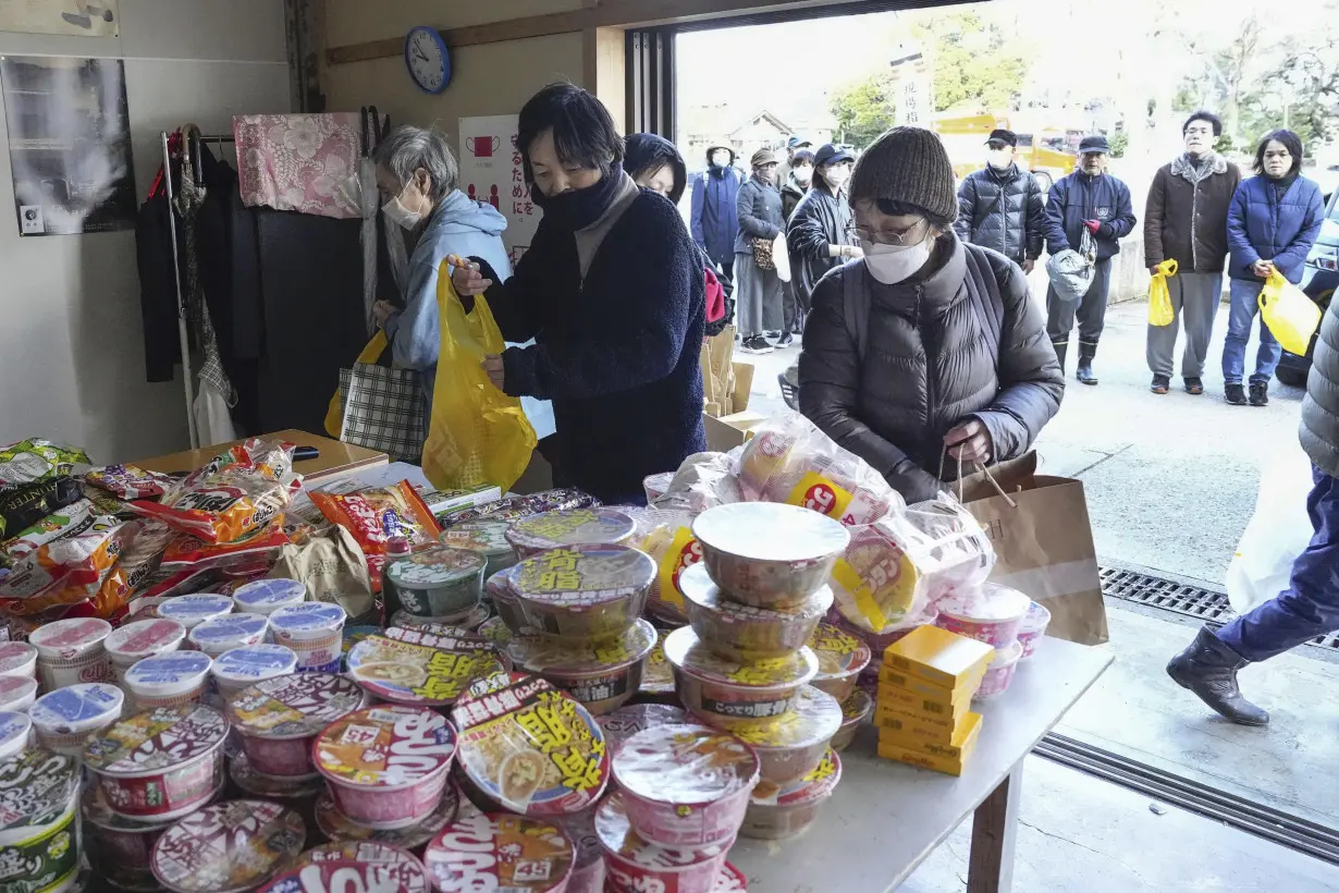 Death toll reaches 100 as survivors are found in homes smashed by western Japan earthquakes