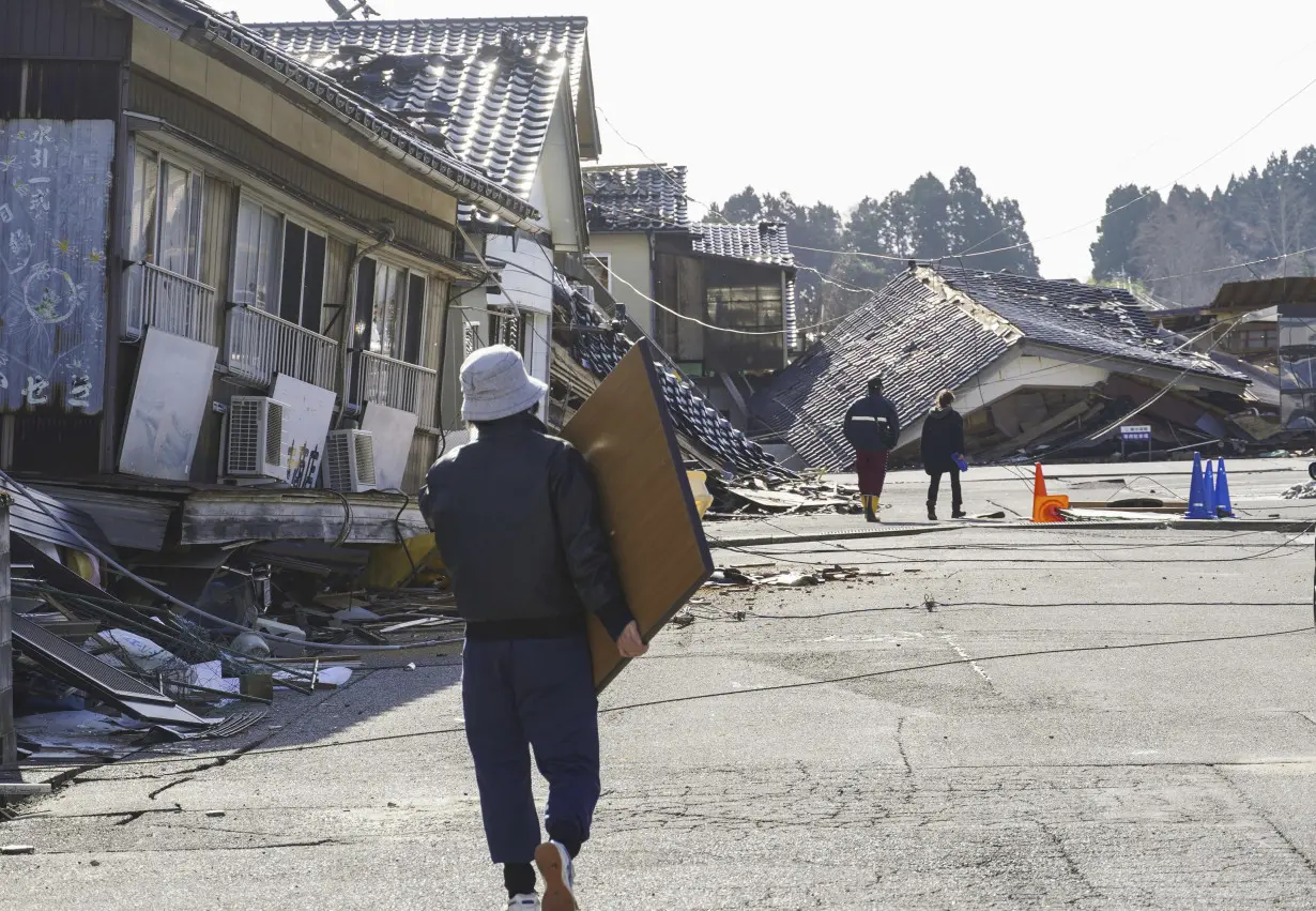 Death toll reaches 100 as survivors are found in homes smashed by western Japan earthquakes