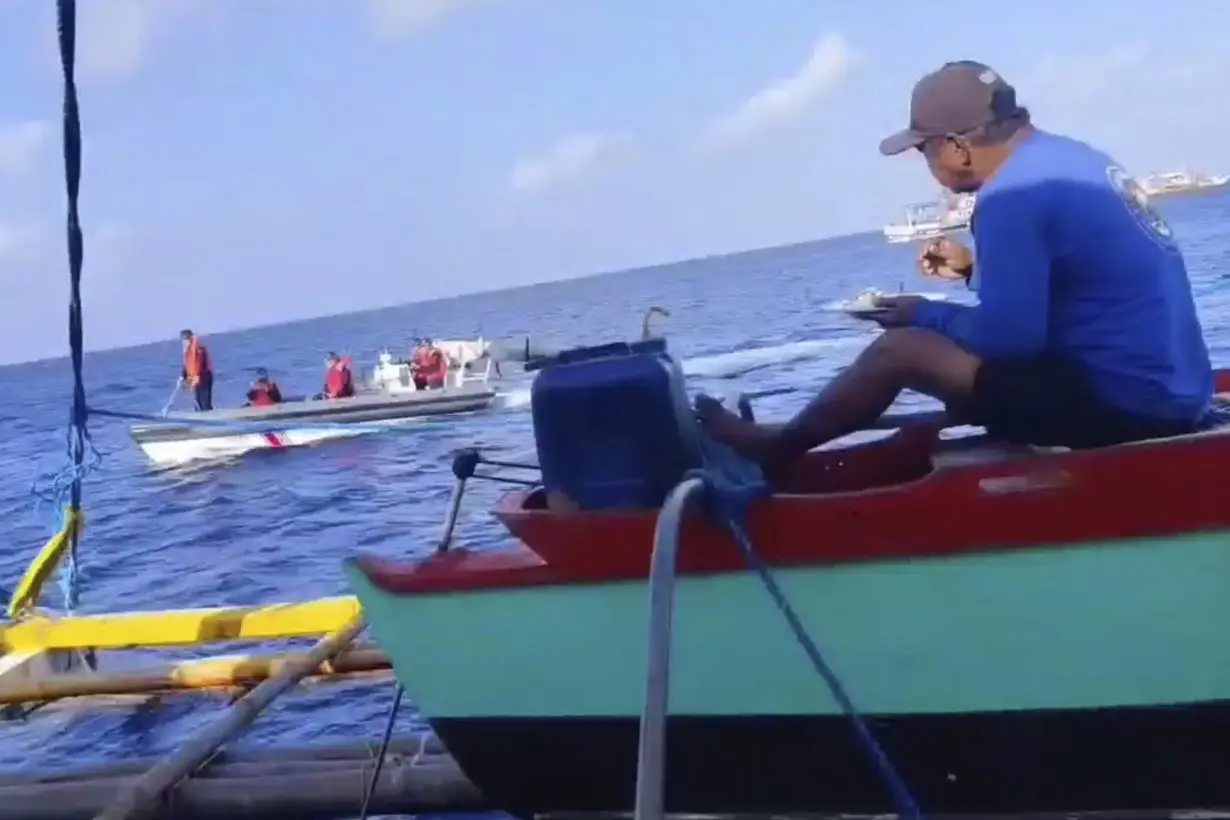 Filipino fisherman to China's coast guard on disputed shoal: `This is Philippine territory. Go away'