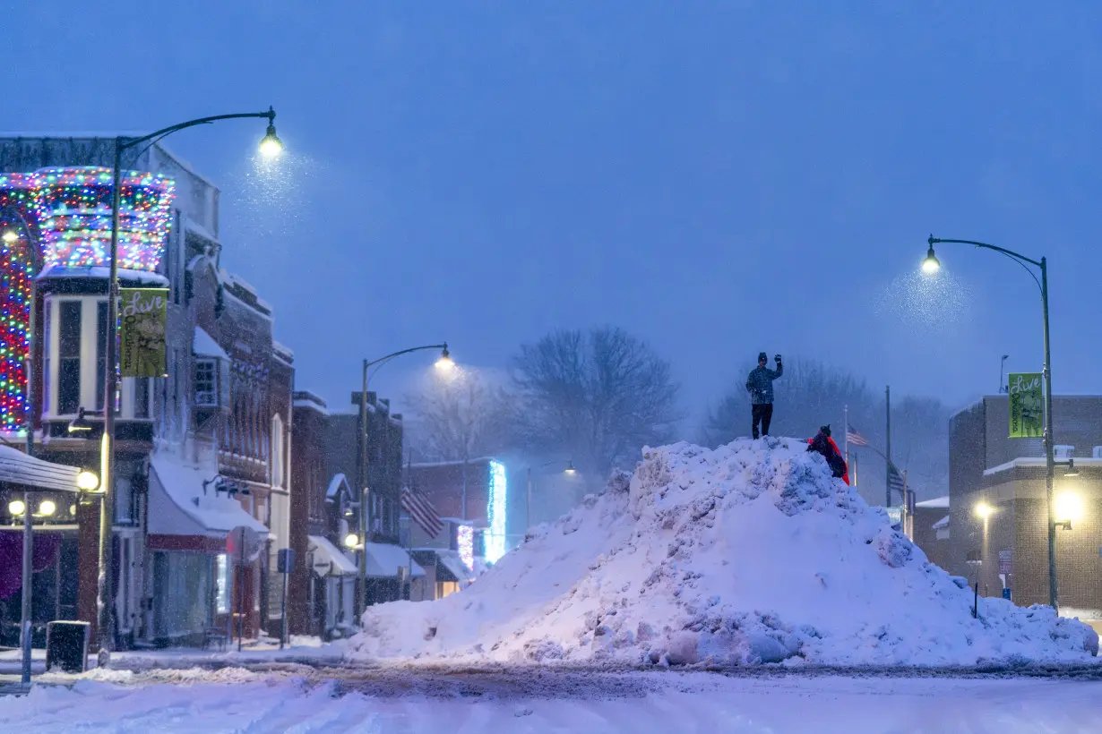 Record-breaking cold threatens to complicate Iowa's leadoff caucuses as snowy weather cancels events