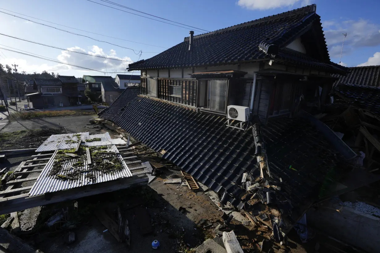 Scenes of loss play out across Japan's western coastline after quake kills 92, dozens still missing