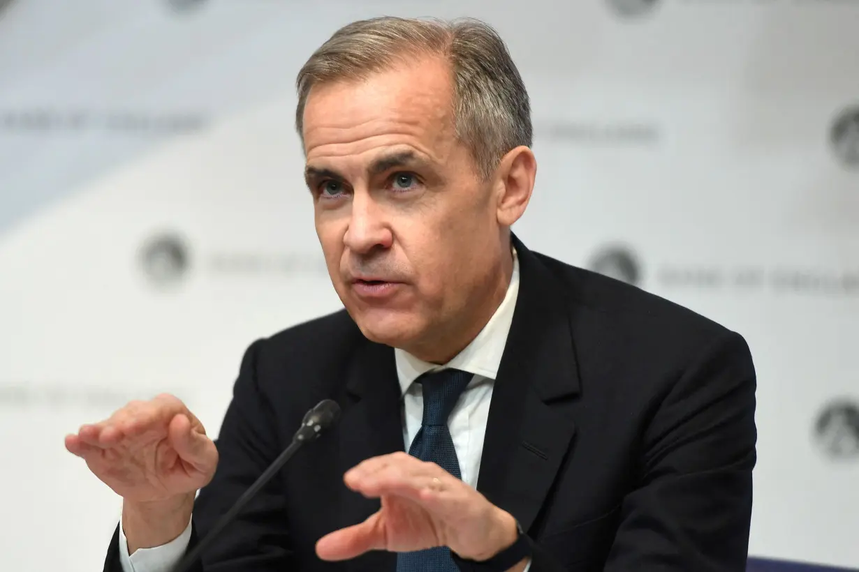 FILE PHOTO: Mark Carney, governor of the Bank of England (BOE) attends a news conference at Bank Of England in London