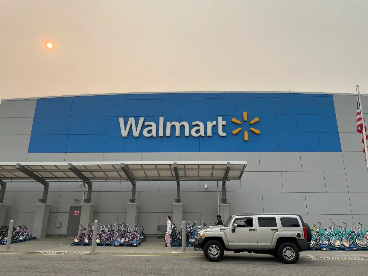 FILE PHOTO: A shopper leaves a Walmart Supercenter in Secaucus, New Jersey