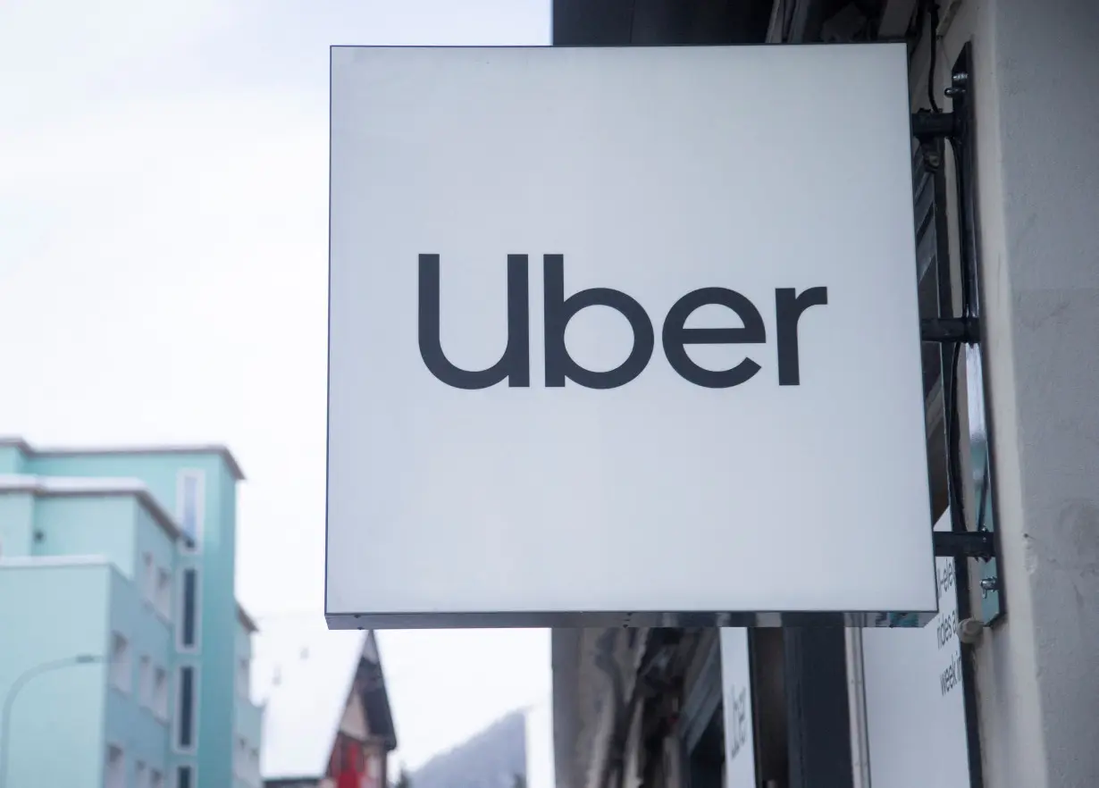 Logo of Uber is seen at a temporary showroom during the World Economic Forum in Davos