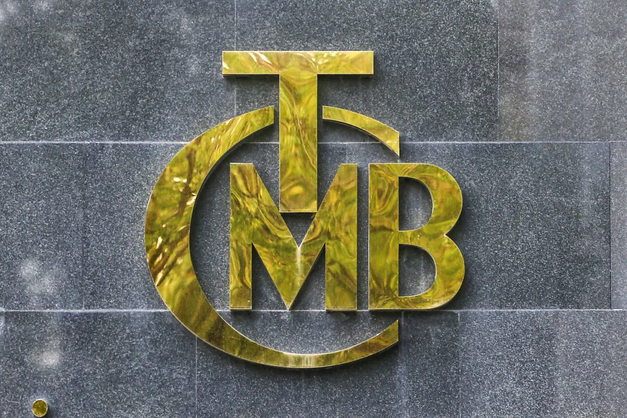 FILE PHOTO: A logo of Turkey's Central Bank is pictured at the entrance of its headquarters in Ankara