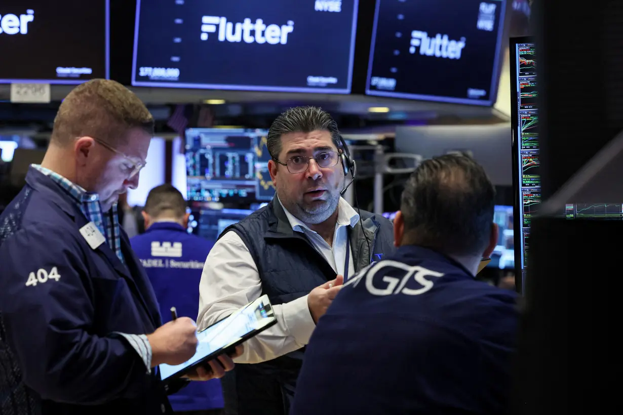 Traders work on the floor of the NYSE in New York