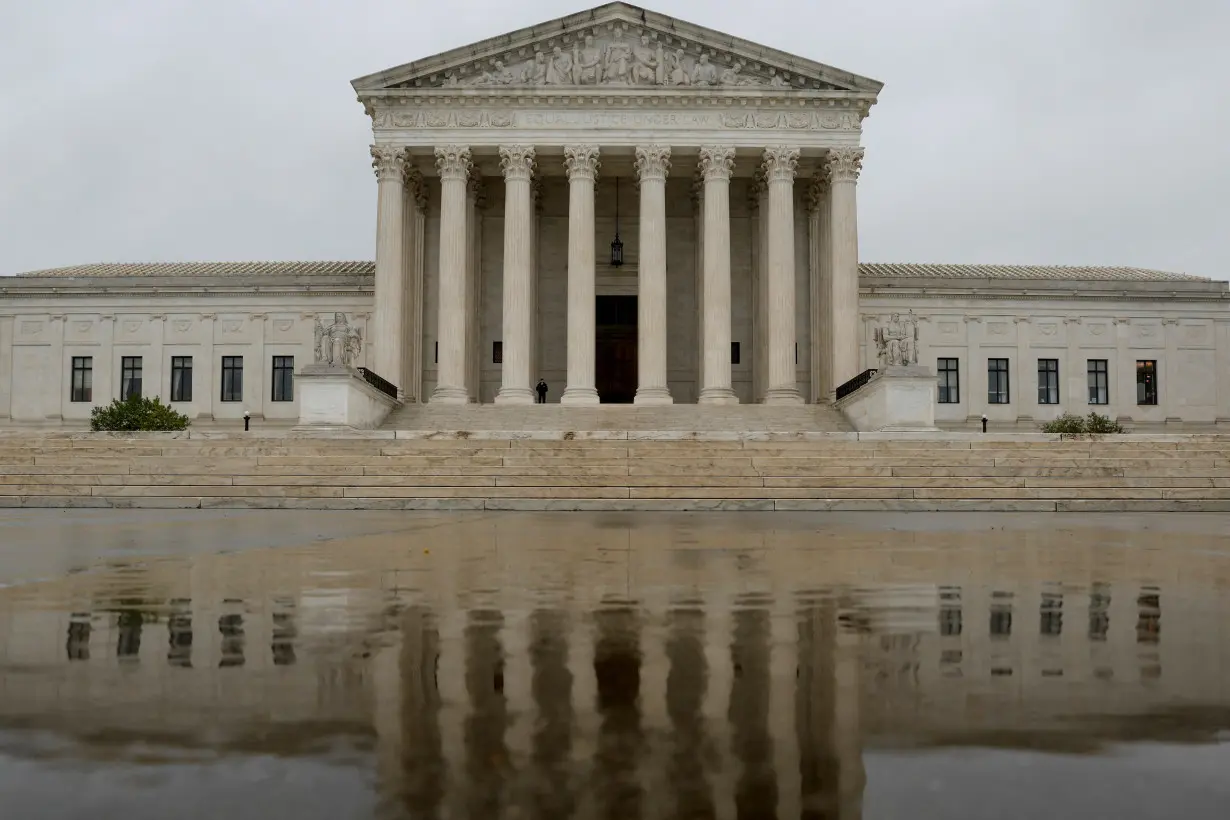 A general view of the U.S. Supreme Court building in the rain the day before the start of the court's new term in Washington