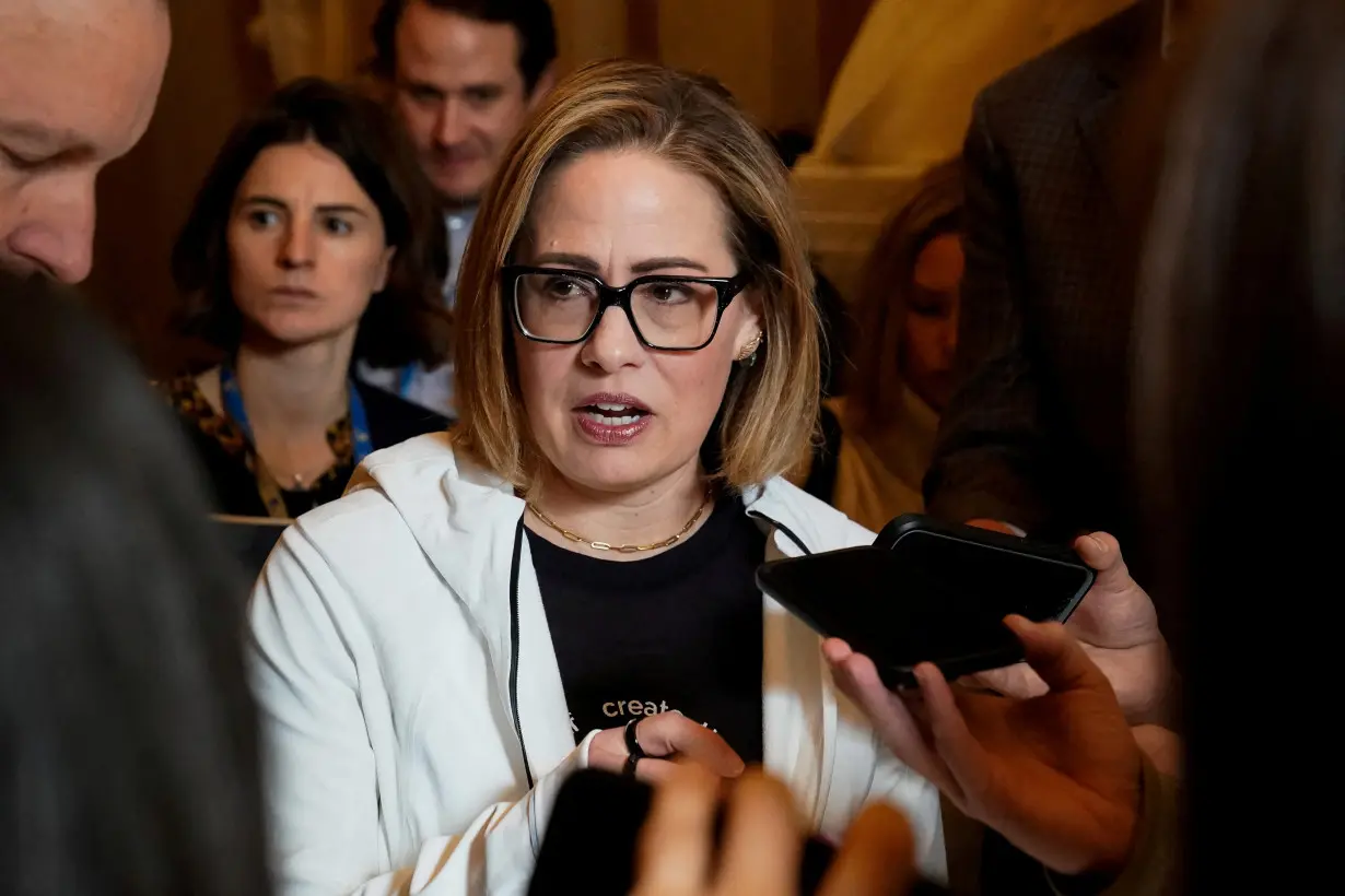 FILE PHOTO: U.S. Senators Chris Murphy and Kyrsten Sinema at the U.S. Capitol in Washington