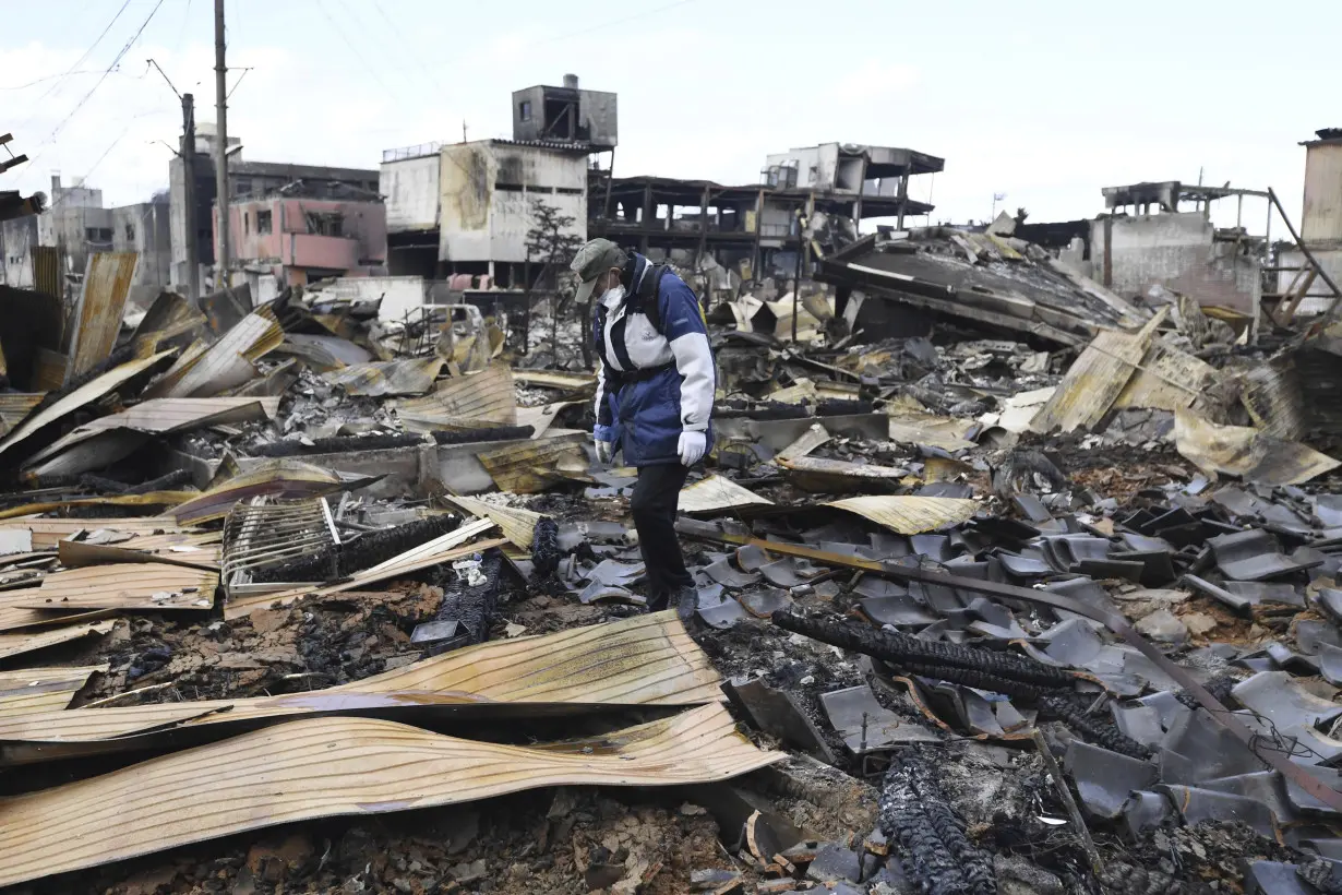 Scenes of loss play out across Japan's western coastline after quake kills 92, dozens still missing