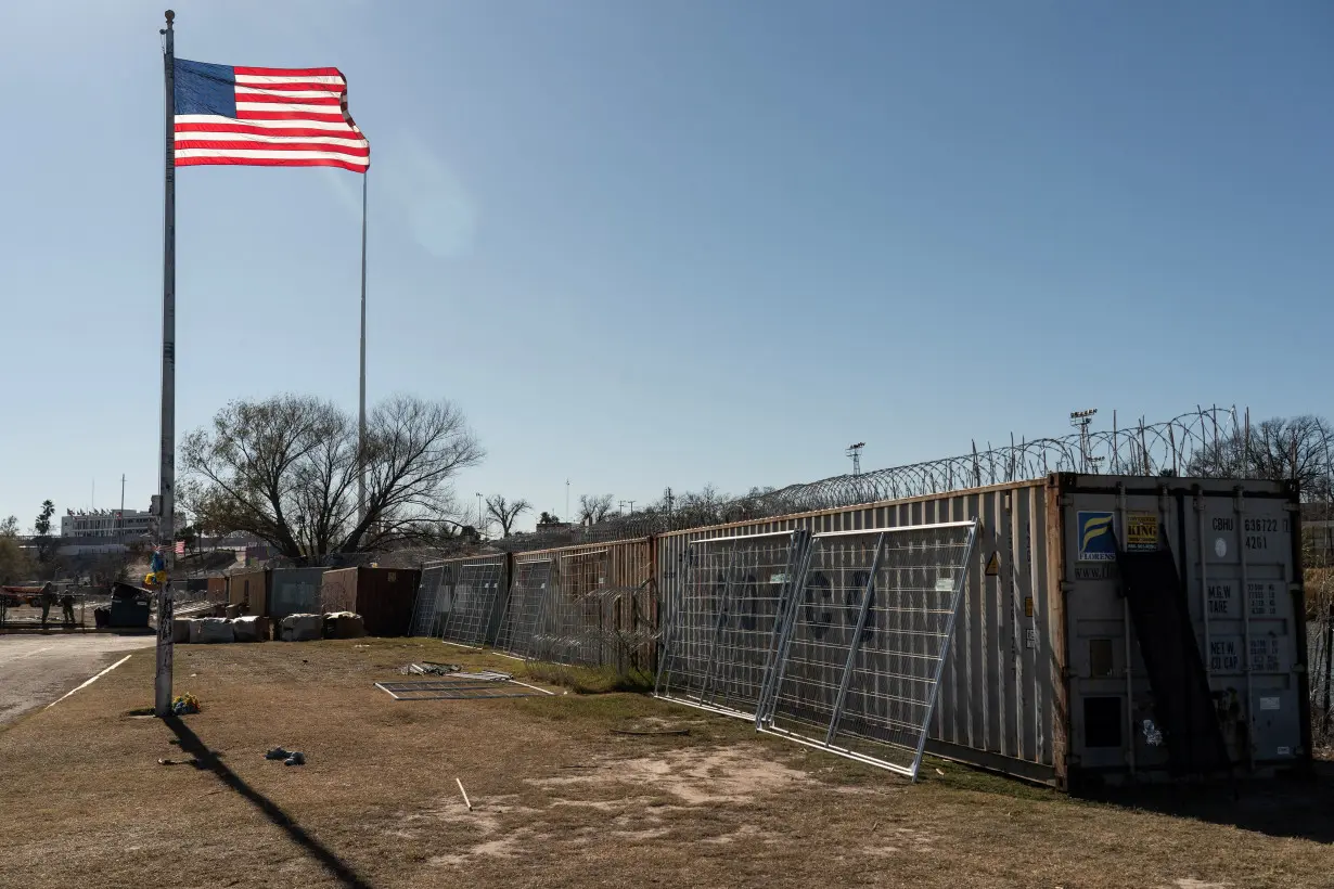 Migrants cross the border into Texas from Mexico