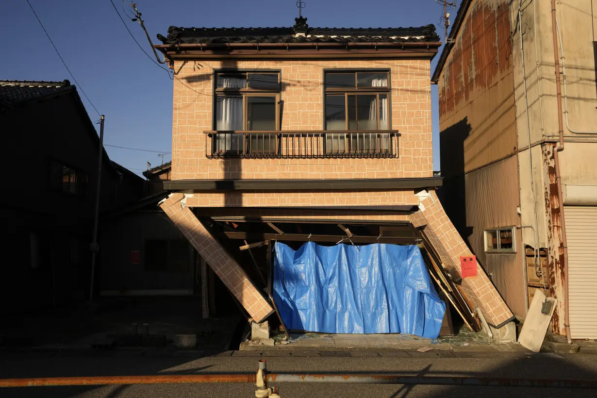 Scenes of loss play out across Japan's western coastline after quake kills 92, dozens still missing