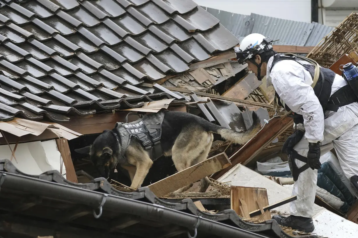 Rescuers race against time in search for survivors in Japan after powerful quakes leave 78 dead