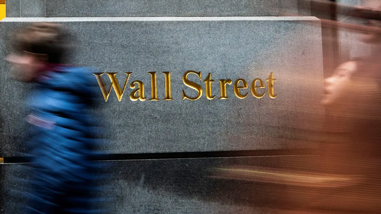 FILE PHOTO: Wall Street ends slightly lower, capping blockbuster year