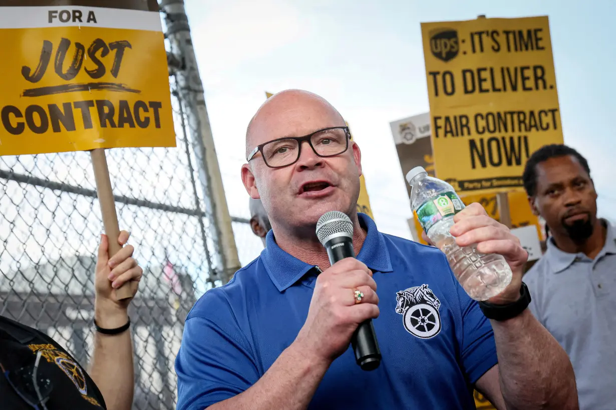 FILE PHOTO: UPS Teamsters picket ahead of an upcoming possible strike in Brooklyn, New York