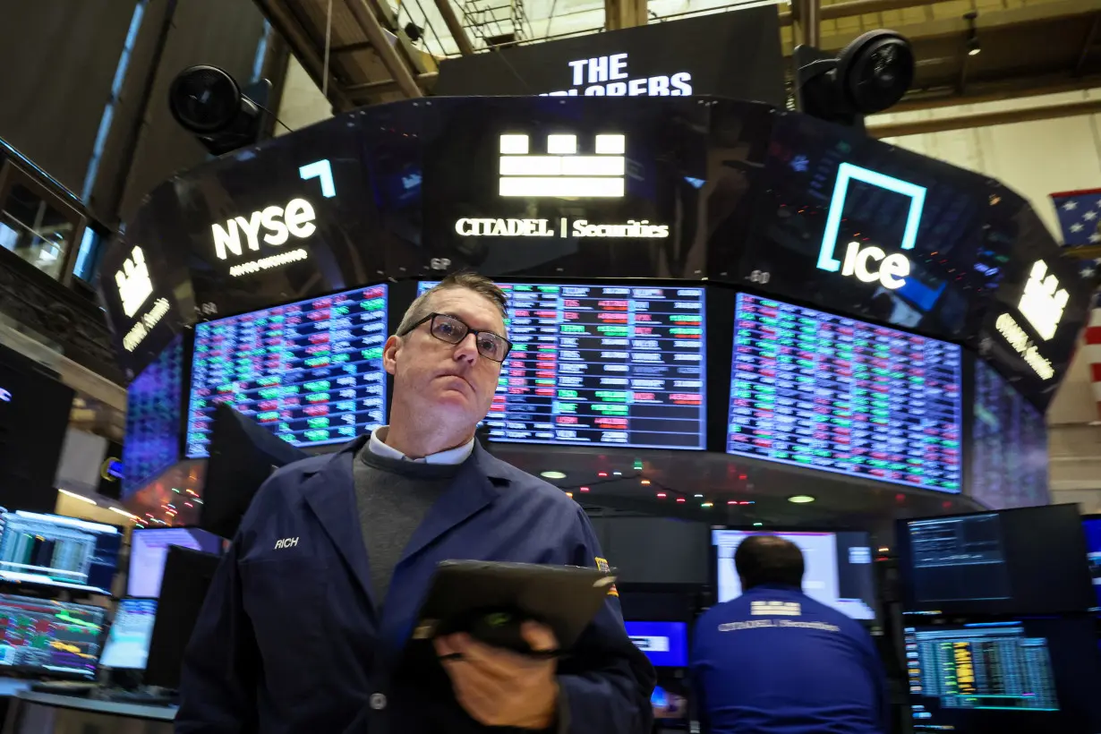 Traders work on the floor of the NYSE in New York