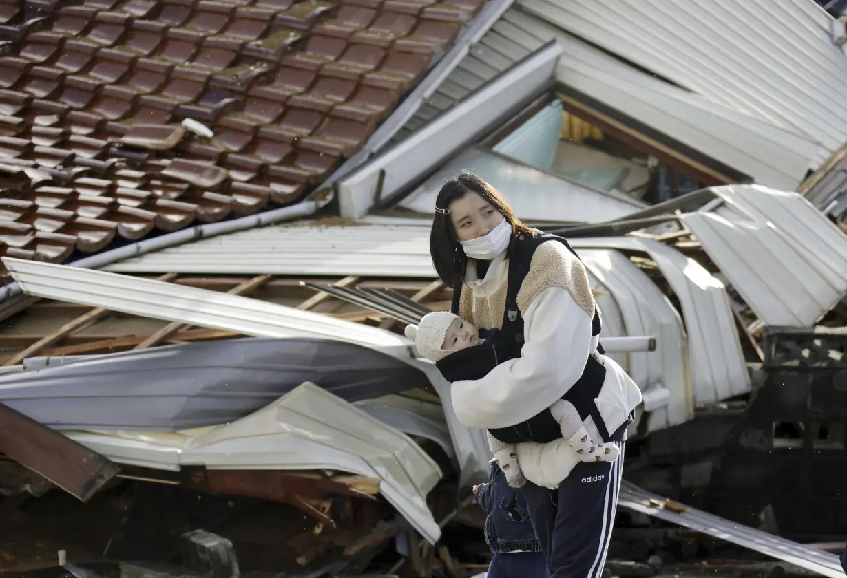 Rescuers race against time in search for survivors in Japan after powerful quakes leave 78 dead