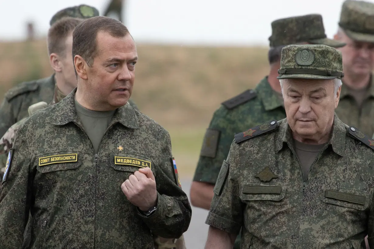 Russia's Deputy head of the Security Council Dmitry Medvedev visits the Prudboi military training ground in Volgograd region