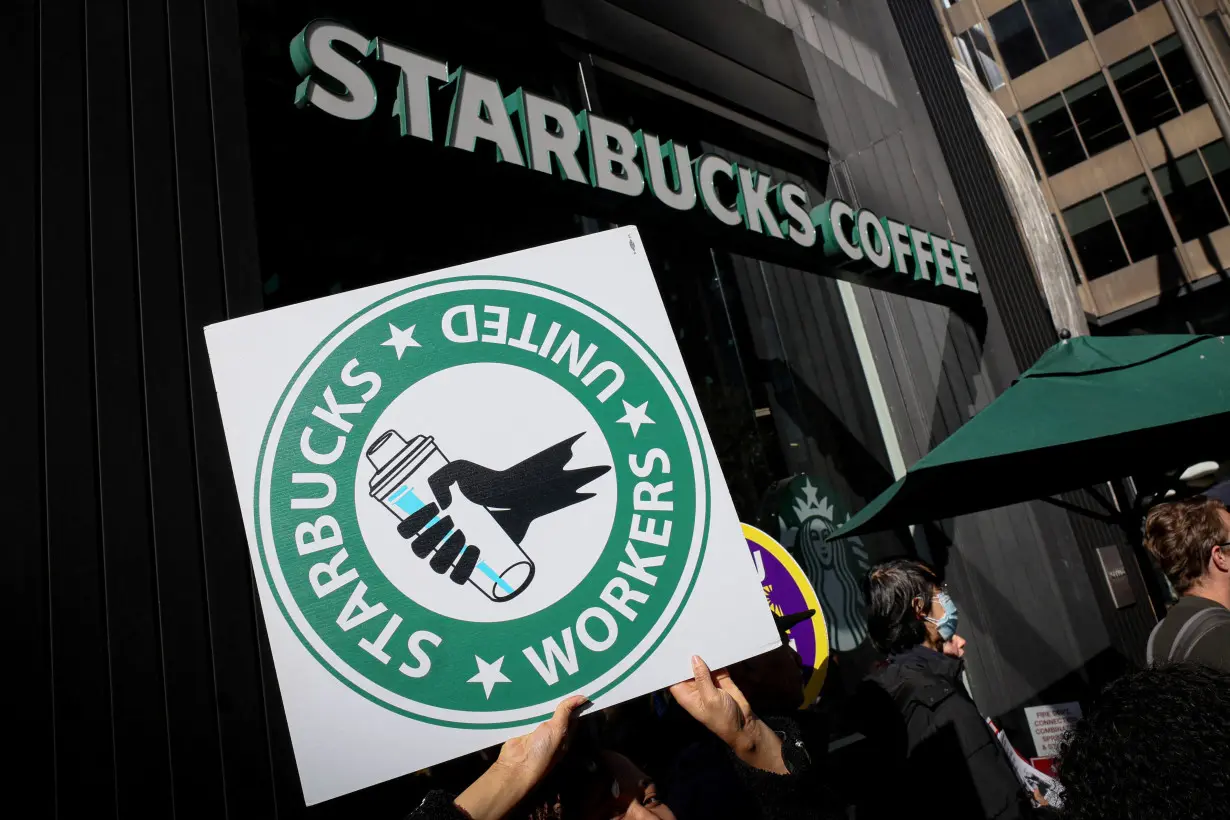 FILE PHOTO: Members of the Starbucks Workers Union picket and hold a rally outside Starbucks store in New York