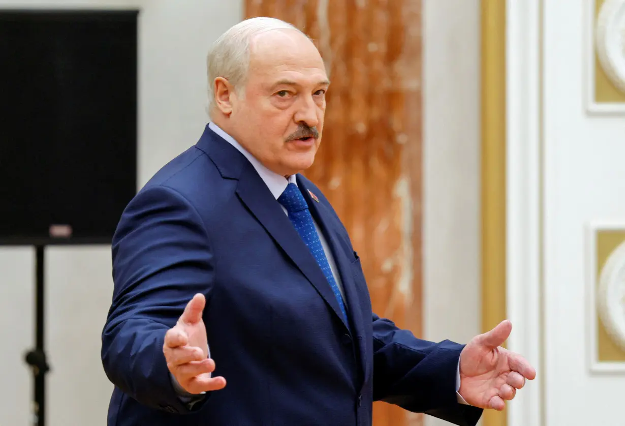 Belarusian President Alexander Lukashenko gestures before a press conference in Minsk