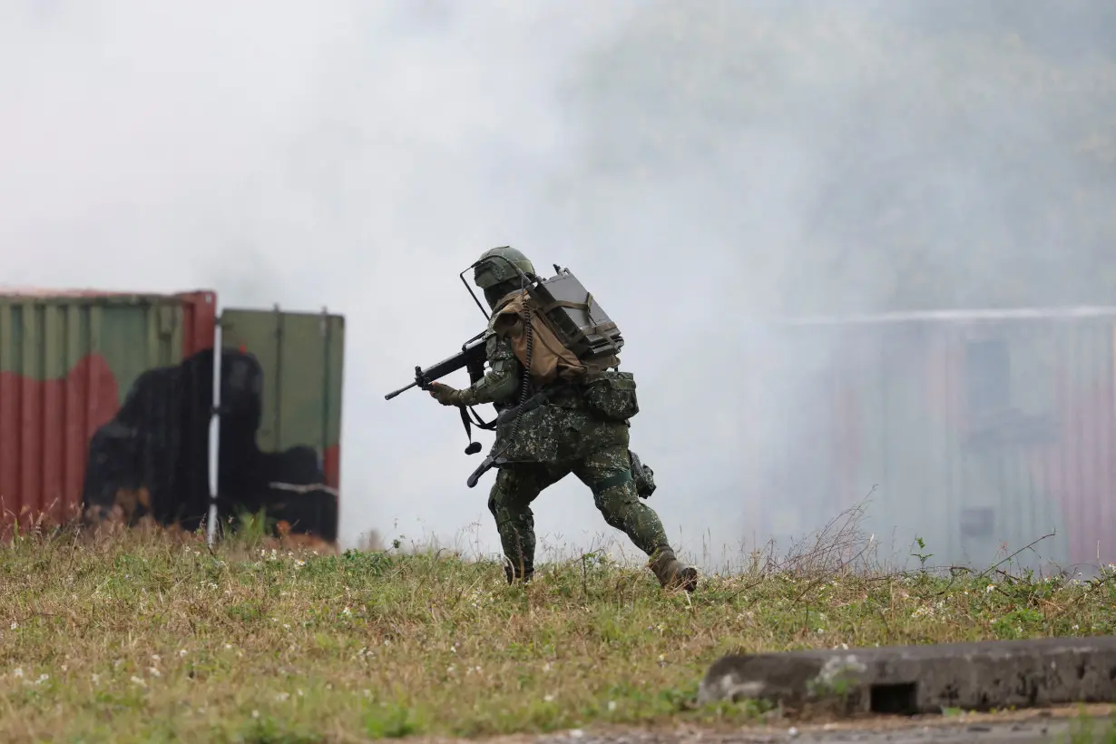 Members of Taiwan’s armed forces participate in a drill as part of a demonstration for the media at a military base in Taitung