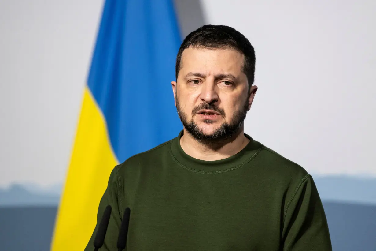 FILE PHOTO: Ukrainian President Volodymyr Zelenskiy speaks at a press conference while in Switzerland