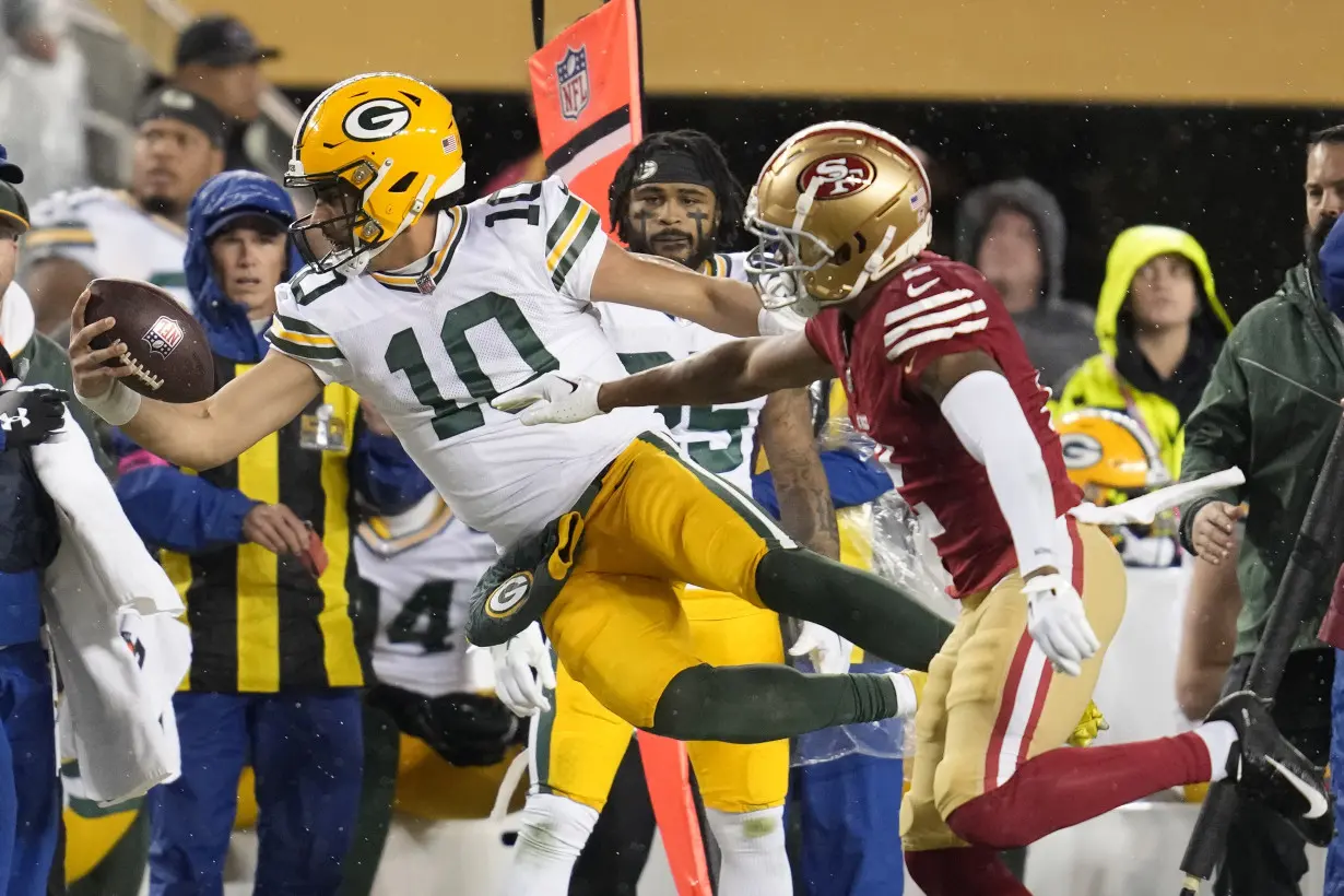 Christian McCaffrey's 2nd TD rallies the 49ers to 24-21 playoff win over Jordan Love and the Packers