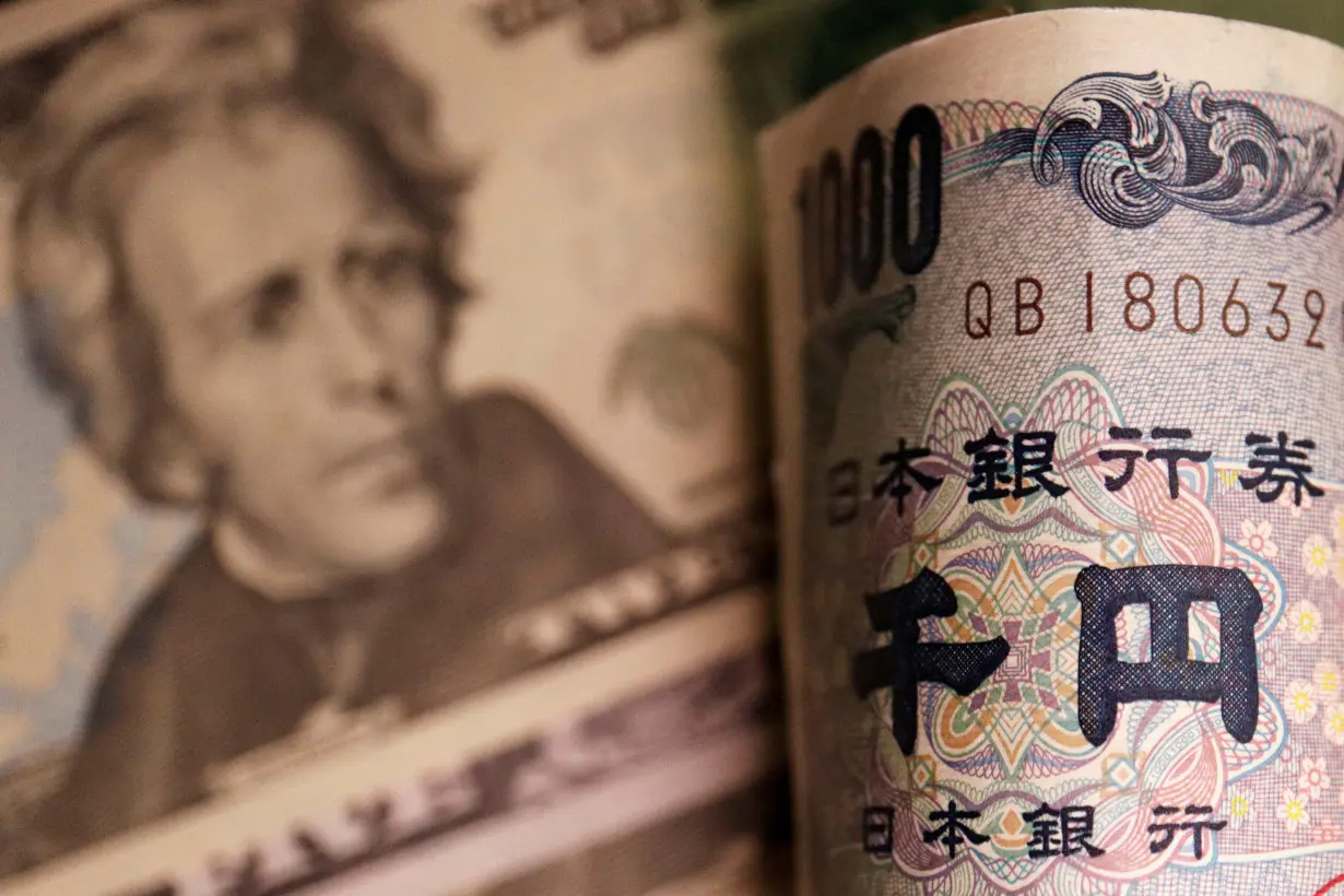 FILE PHOTO: Illustration picture of Japanese yen and U.S. dollar banknotes