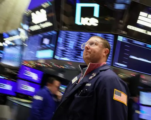 Wall Street ends topsy-turvy day marginally up