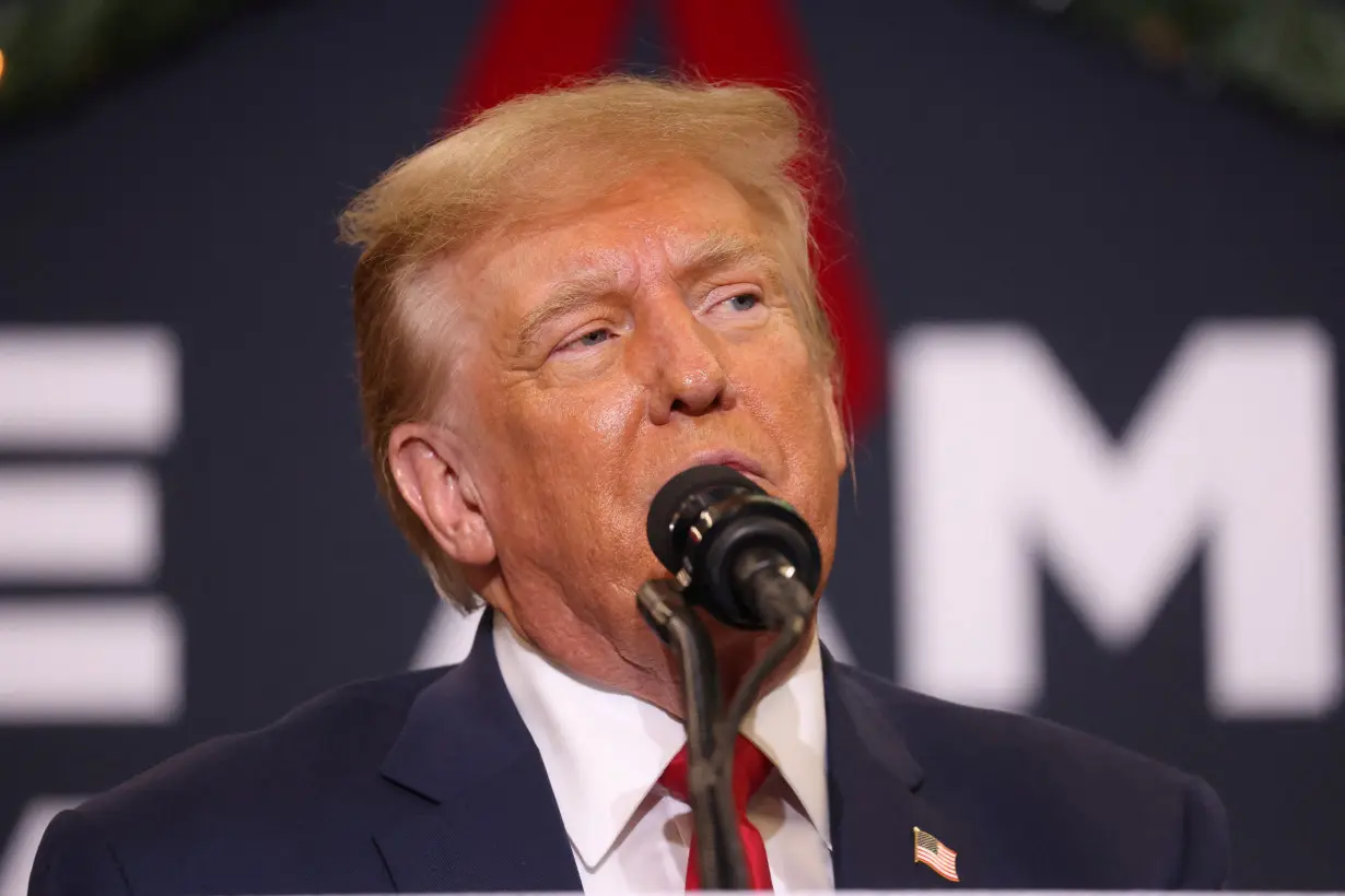 FILE PHOTO: Republican presidential candidate and former U.S. President Trump attends a campaign event in Waterloo, Iowa