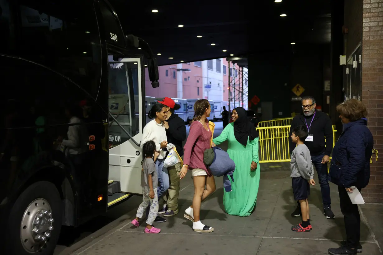 Migrants arrive from Texas by bus at the Port Authority bus terminal in New York City