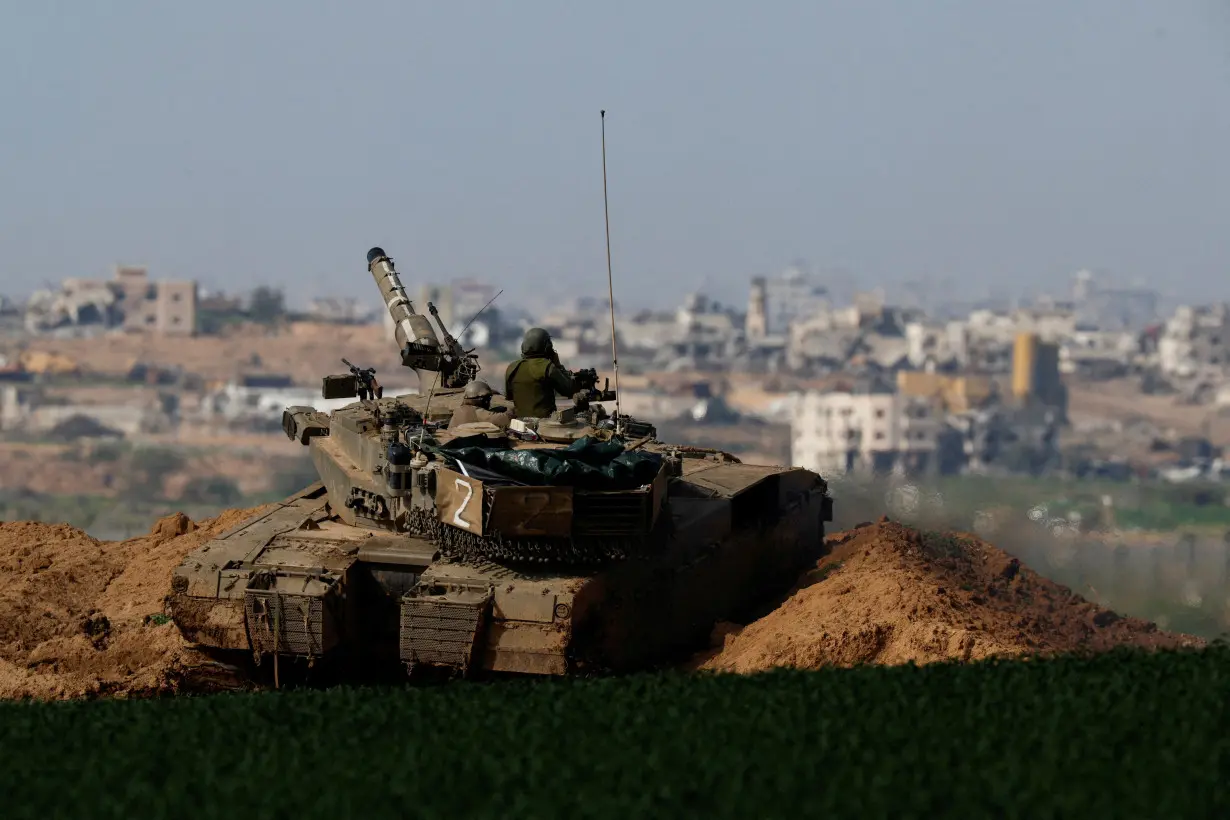 FILE PHOTO: Israeli tank manoeuvres near Israel-Gaza border