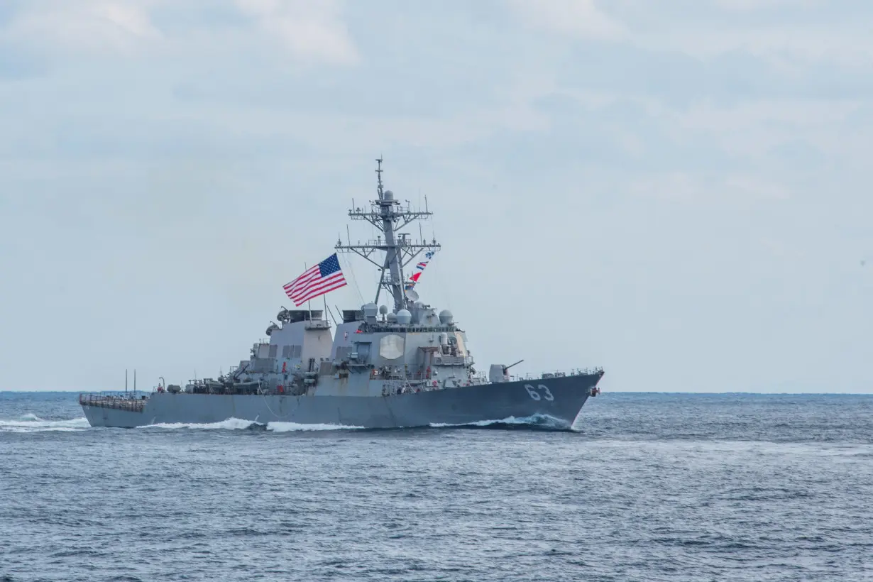 The Arleigh Burke-class guided-missile destroyer USS Stethem (DDG 63) steams during a three-carrier strike force photo exercise in the Western Pacific