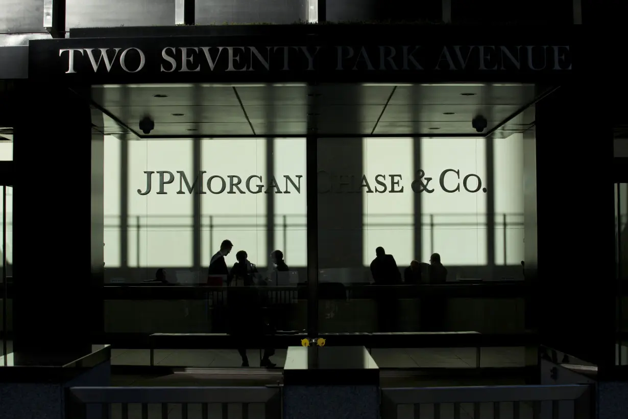 People walk inside JP Morgan headquarters in New York