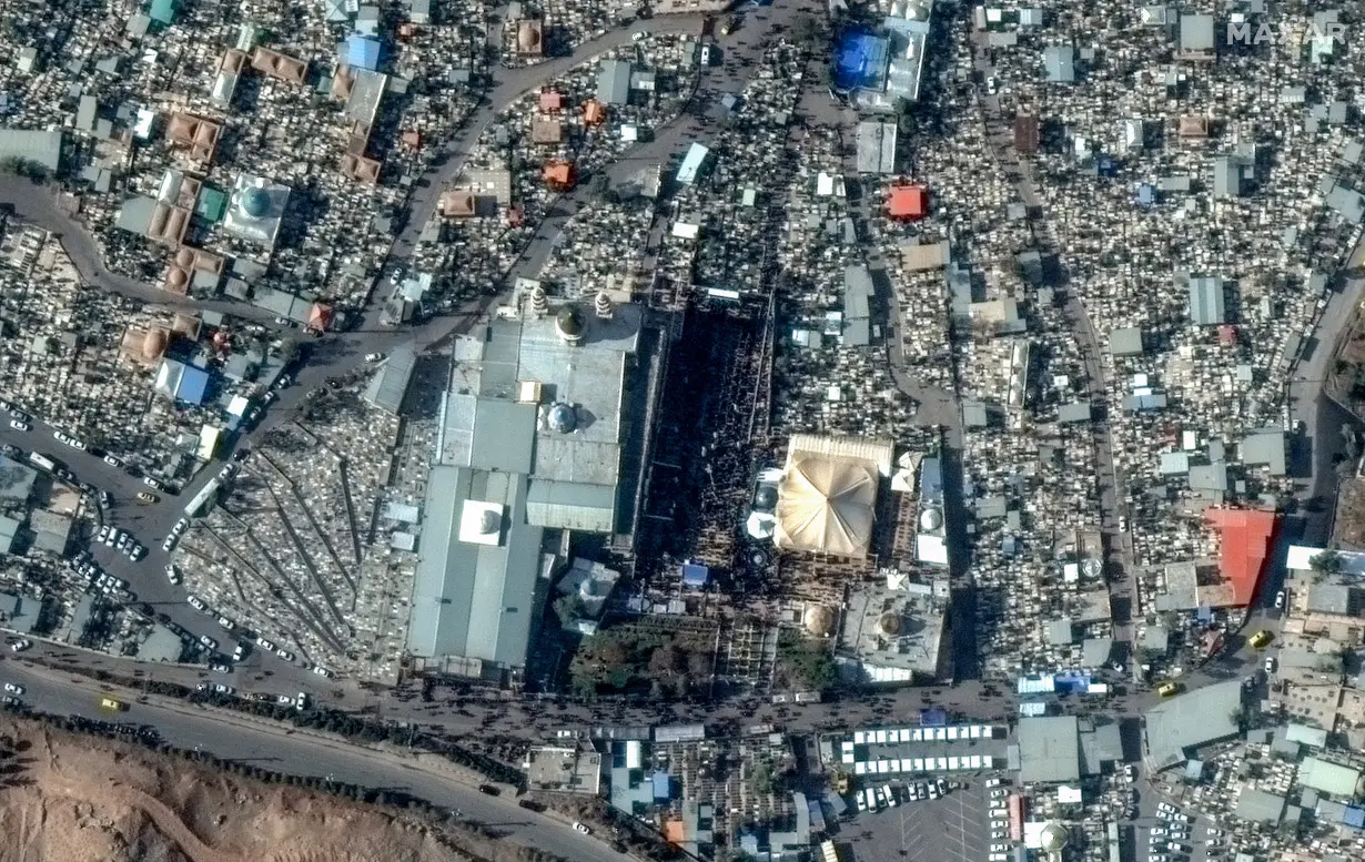 FILE PHOTO: A satellite image shows a large crowd of mourners gathering at the Kerman Martyr's Cemetery in Kerman